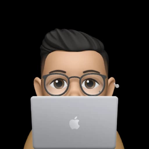 person peeking from behind a macbook